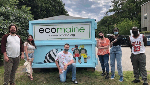groupshot2 People pose in front of an Ecomaine silver bullet painted by a local artist
