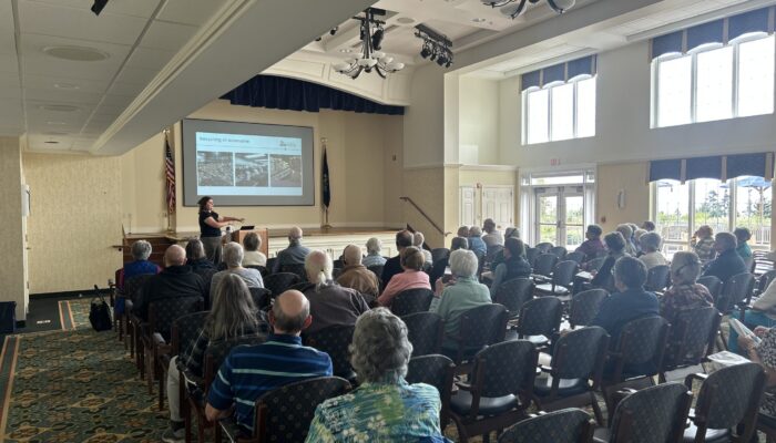 Sarah Folan presents to a group at Piper Shores in Scarborough, Maine.