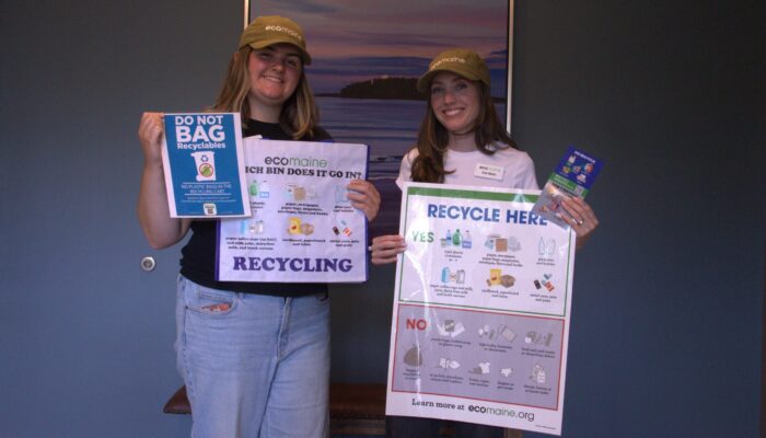 The Multi-Family Recycling Team, including Sarah & Zoe, pose with new programming for Piper Shores